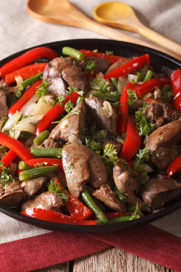 Braised Chicken Liver with Onion and Pepper Closeup. Vertical Stock