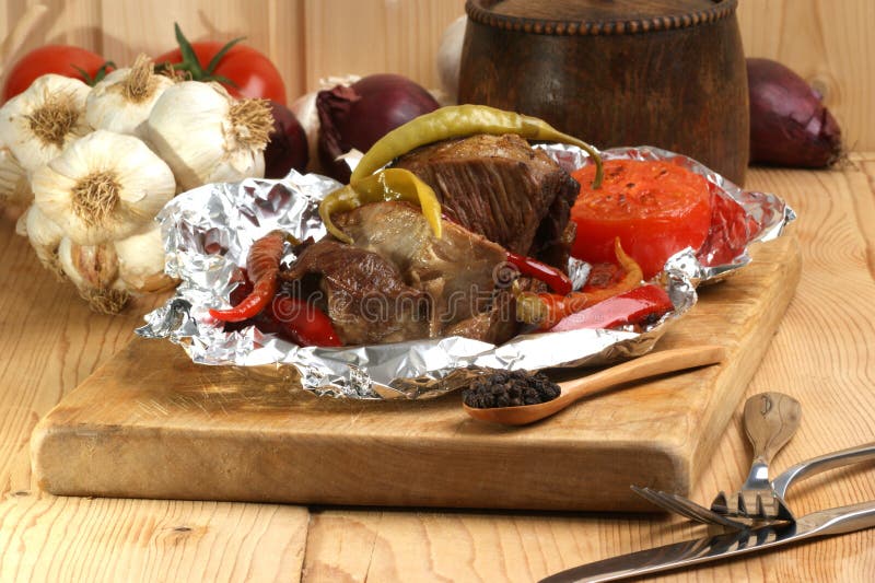 Braised meattennfolie arkivbilder