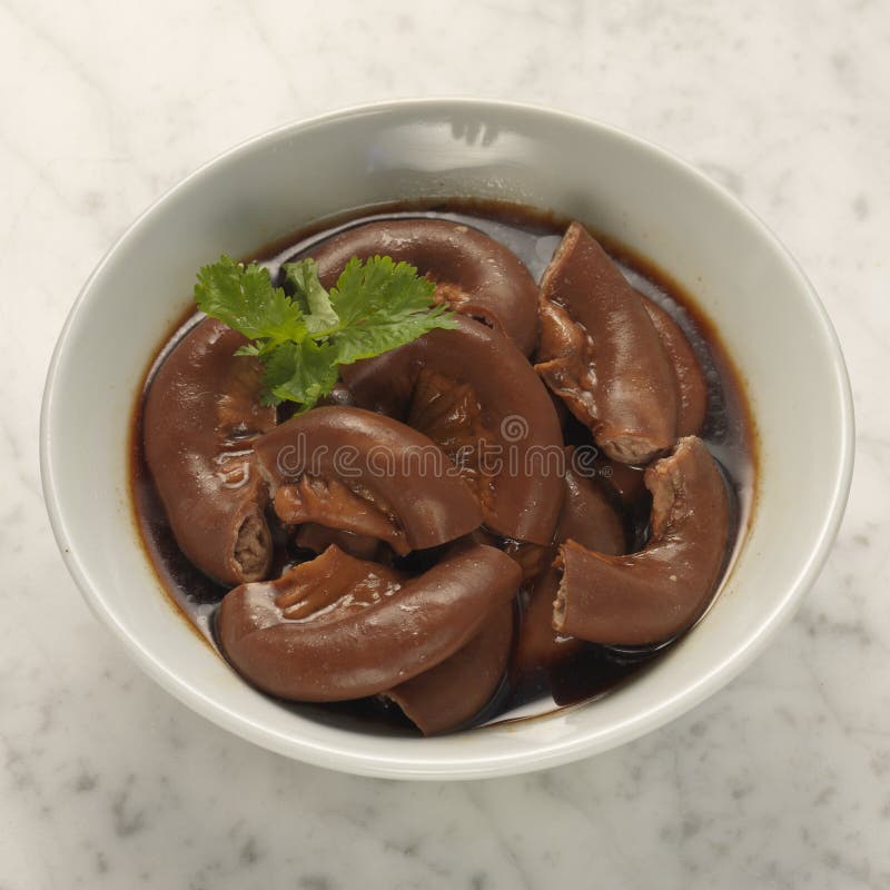 Braised pig stomach. Traditional braised pig belly in soya sauce side dish in singapore and malaysia for bak kut teh, pork rib soup stock images Braised pig stomach. Traditional braised pig belly in soya sauce side dish in singapore and malaysia for bak kut teh, pork rib soup stock images