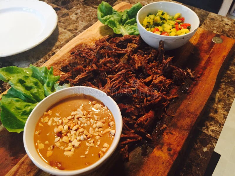 Braised short rib with peanut sauce and mango salsa royalty free stock photo