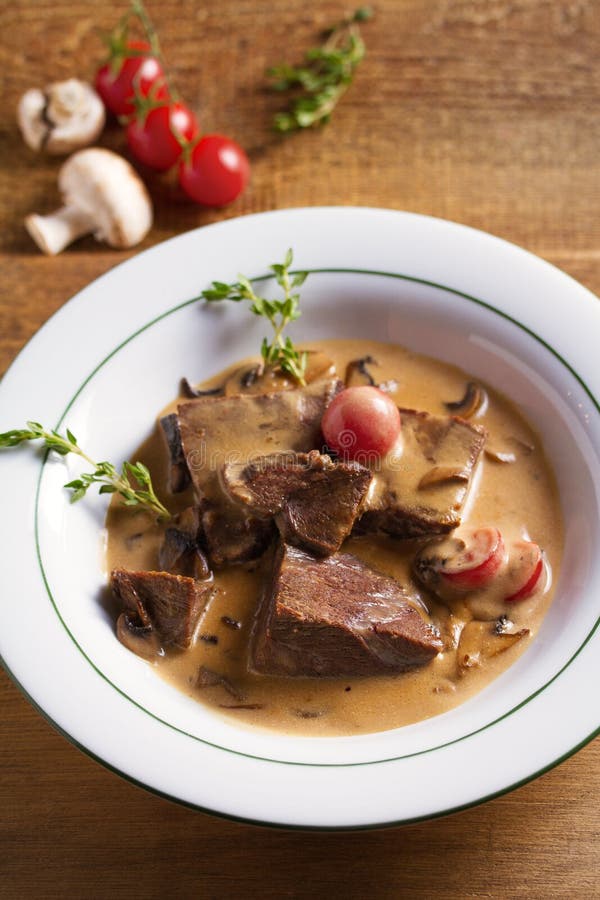 Braised Veal Cheeks in Cream Sauce with Mushrooms. Stock Photo Image