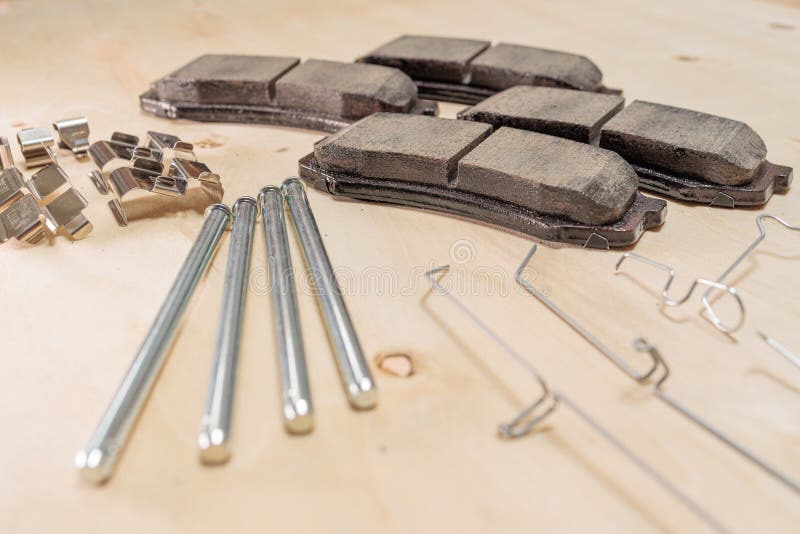 Brake Replacement Kit Showing Brake Pads, Caliper Pins, Shims, Wear Indicators, and Hardware stock photography