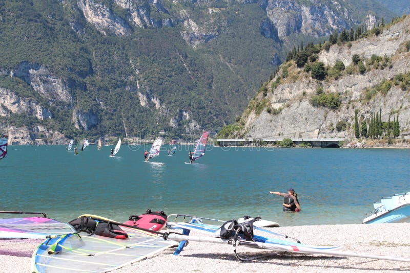 Surf beaches Lago di Garda in Italy,waiting for wind on the pebble beach. Surf beaches Lago di Garda in Italy,waiting for wind on the pebble beach