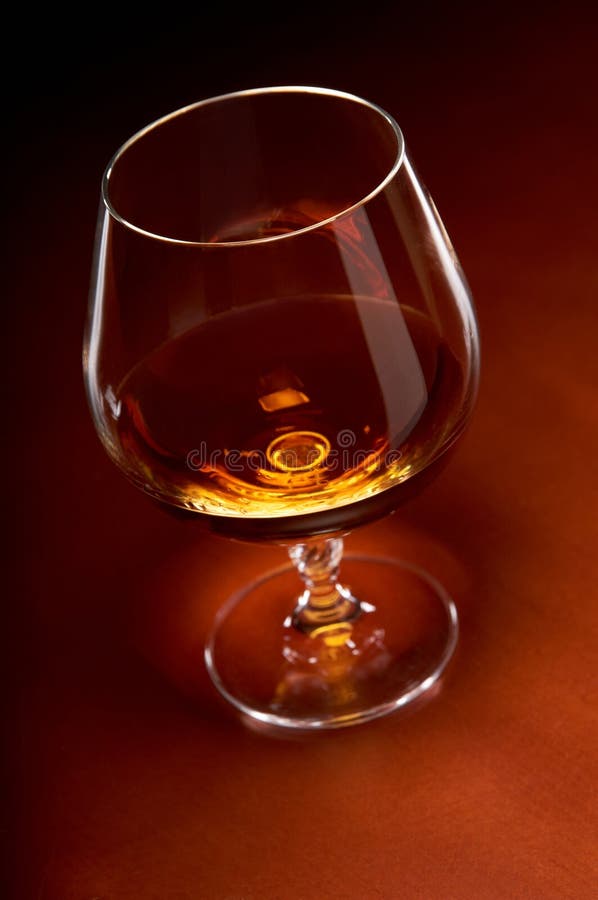 Brandy in a glass stock image. Image of glass, single 21974251