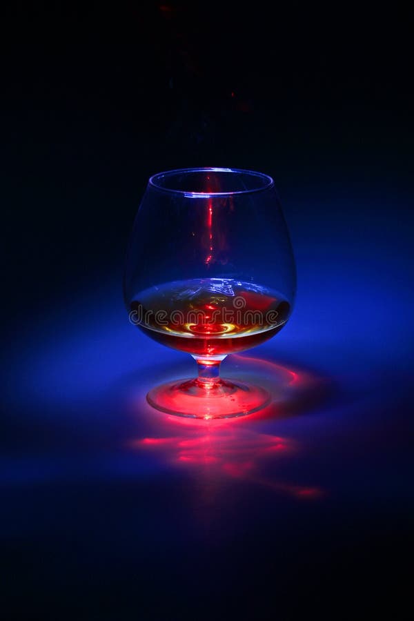Brandy Glass with Red Abstract and Blue Light Stock Image Image of