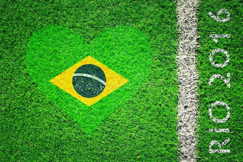 Brasilien-Flagge auf Gras mit Rio-Sommer Olympicshintergrund stockfotografie Brasilien-Flagge auf Gras mit Rio-Sommer Olympicshintergrund stockfotografie