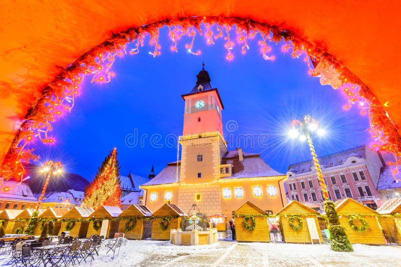 Brasov, Romania. Christmas Market in Main Square, with Xmas Tree and lights. Transylvania landmark. Brasov, Romania. Christmas Market in Main Square, with Xmas Tree and lights. Transylvania landmark.