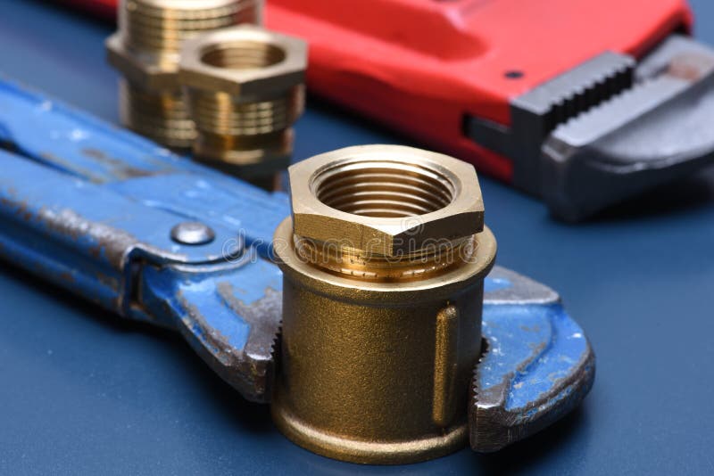 Brass fittings and wrench stock photo. Image of physical 79791680