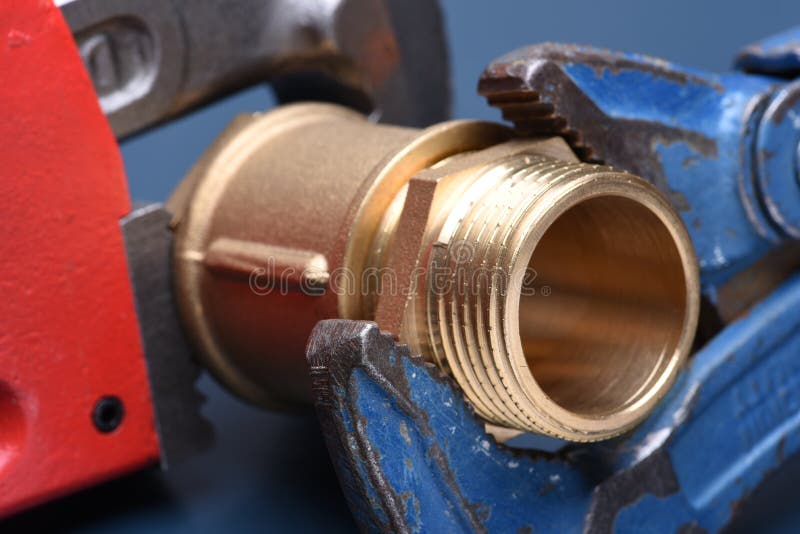 Brass fittings and wrench stock photo. Image of improvement 79792602