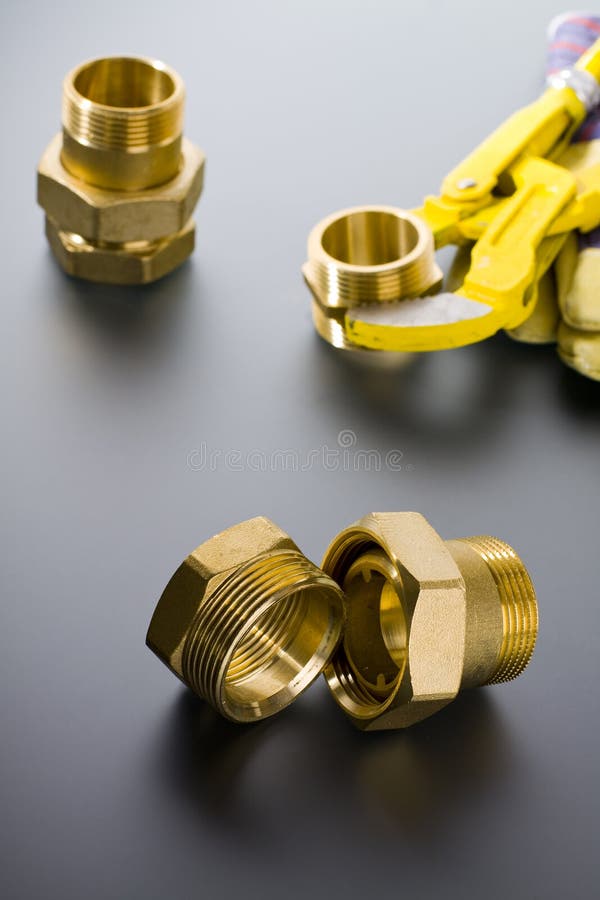 Brass fittings with wrench stock image. Image of golden 63443499