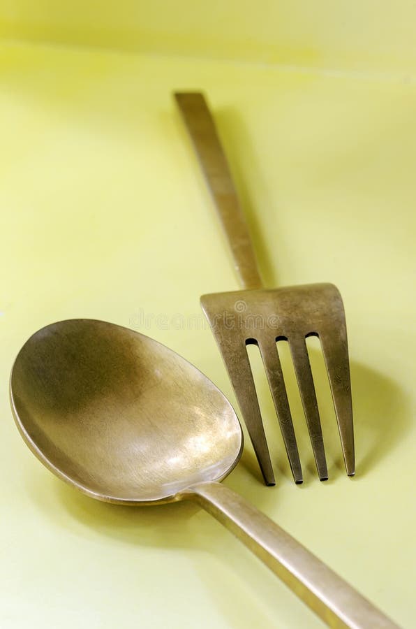 Brass spoon and fork stock image. Image of aged, vintage 54701827