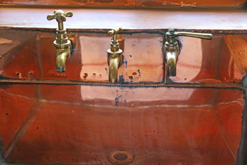 Brass taps and sink stock photo. Image of clean, water 234514112