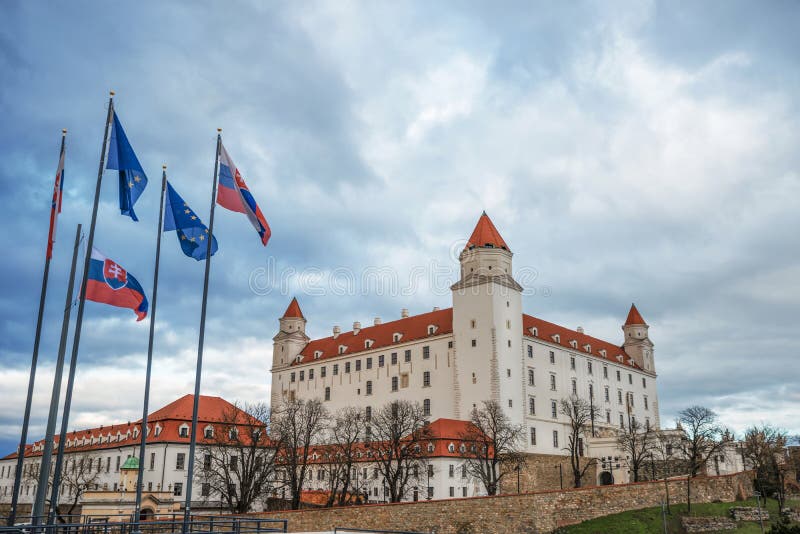 Bratislava Castle with flags of Slovakia and the European Union in Bratislava