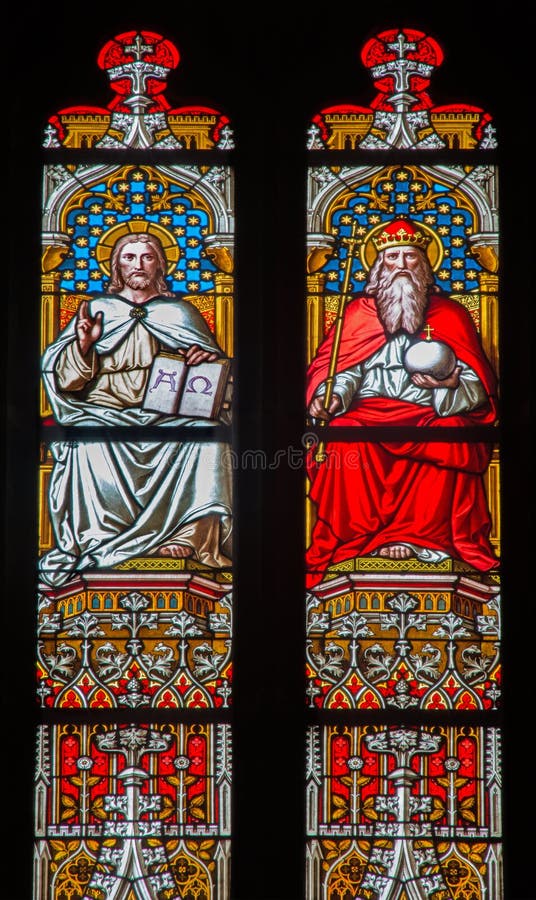 BRATISLAVA, SLOVAKIA - JANUARY 14, 2014: Christ and God the Father on windowpane from 19. from manufactures of Karola Geyling and Eduarda Kratzmann in st. Martin cathedral. BRATISLAVA, SLOVAKIA - JANUARY 14, 2014: Christ and God the Father on windowpane from 19. from manufactures of Karola Geyling and Eduarda Kratzmann in st. Martin cathedral.