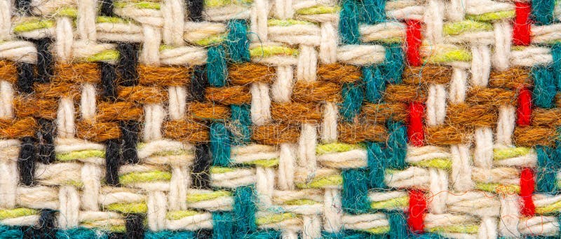 Brown checkered fabric with colored threads. Scottish wool. Fabric for plaid coat and suit. Close-up. Background. Brown checkered fabric with colored threads. Scottish wool. Fabric for plaid coat and suit. Close-up. Background