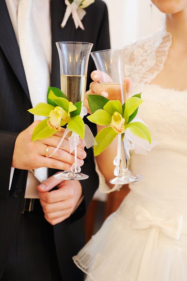 Bride and groom holding champagne glasses. Bride and groom holding champagne glasses