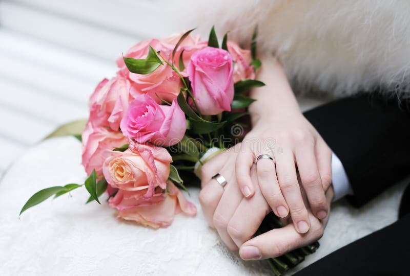 Bride and groom's hands with wedding rings. Bride and groom's hands with wedding rings