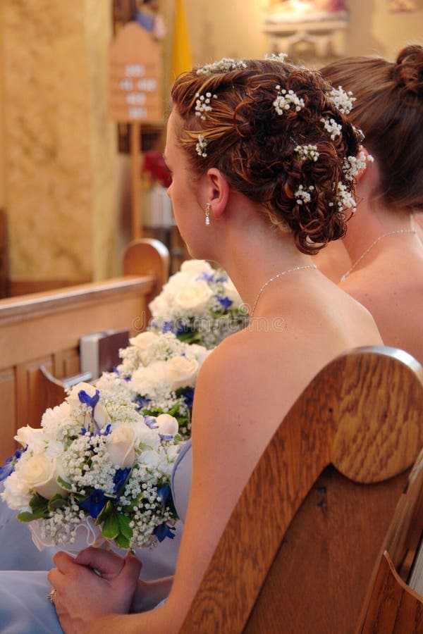 Bridesmaid in church watching ceremony. Bridesmaid in church watching ceremony.