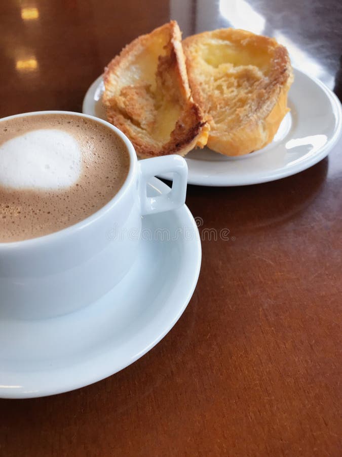 Brazilian Breakfast. Bread Toast with Butter and Coffee on a Table