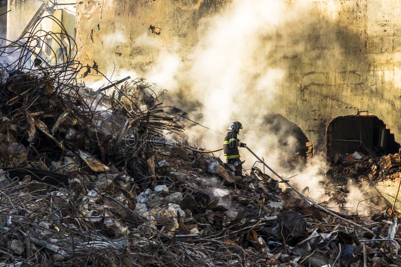 Brazilian Firefighter Fights Flames in the Rubble Where a 24-story ...