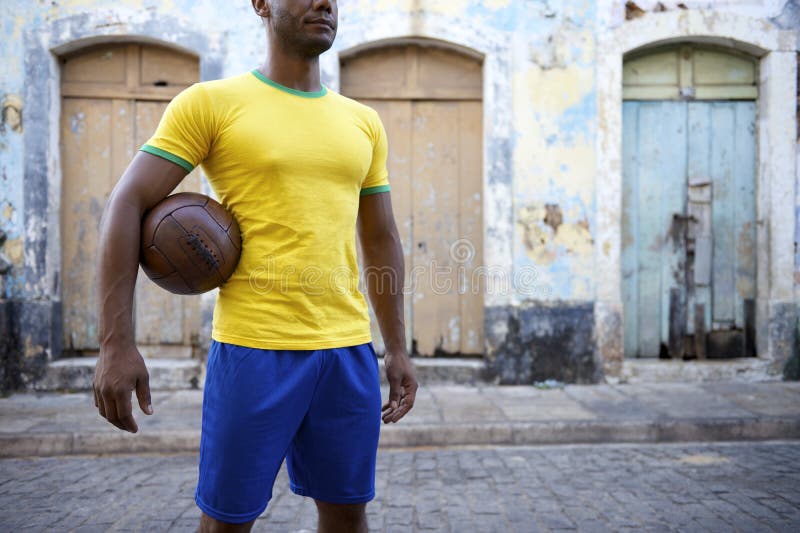 Brazilian Football Player Soccer Holding Ball Village Street royalty free stock photography Brazilian Football Player Soccer Holding Ball Village Street royalty free stock photography