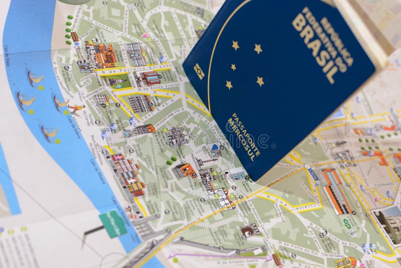 Brazilian passport and map for travel abroad. Brazilian passport and map of the city of Porto in Portugal stock images Brazilian passport and map for travel abroad. Brazilian passport and map of the city of Porto in Portugal stock images