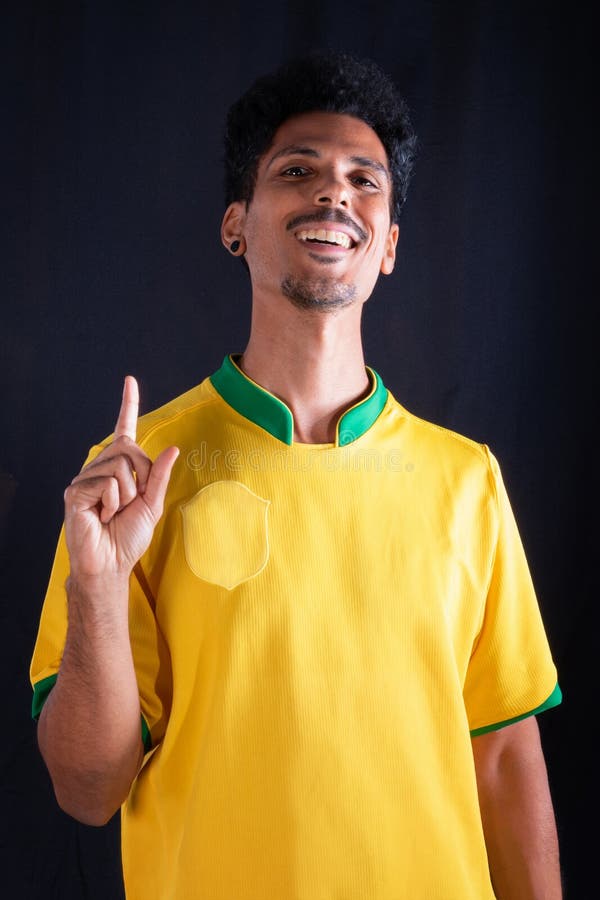 Brazilian Soccer Black Player Fan with Yellow Shirt Celebrating Stock ...