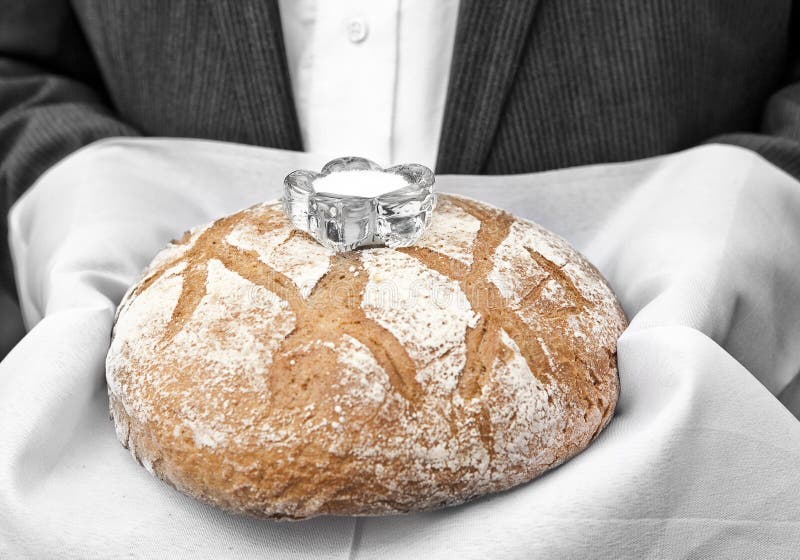 A Traditional Ritual Of Offering Bread And Salt To A Guest
