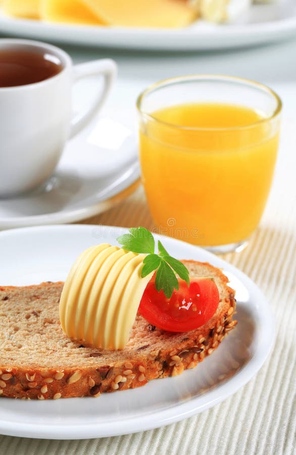 Bread with Butter, Cup of Tea and Orange Juice Stock Photo Image of