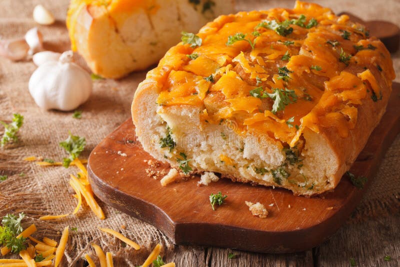 Bread with Cheddar Cheese, Garlic and Herbs Closeup. Horizontal Stock