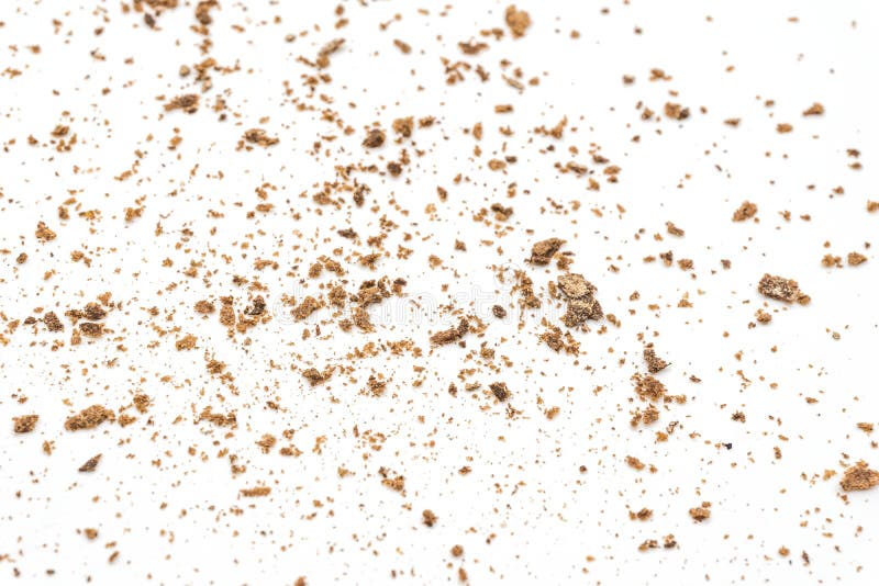 Bread Crumbs on a White Background. Scattered Remnants of Bread Stock