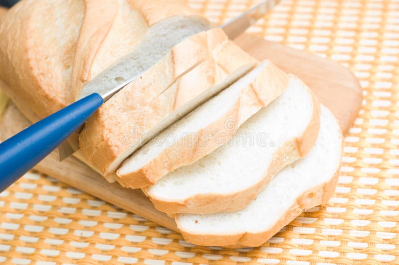 Bread cutting to slices stock photo. Image of closeup 17599382