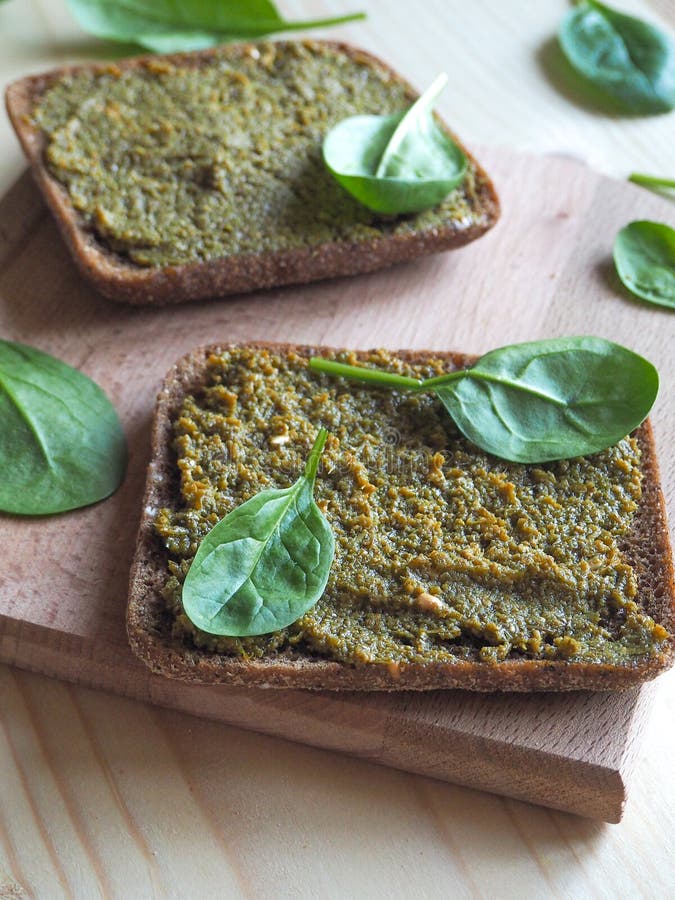 Bread with a delicious sauce of spinach. stock photos Bread with a delicious sauce of spinach. stock photos