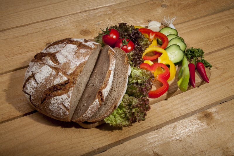 Bread with fresh vegetable stock image. Image of onion 48502395