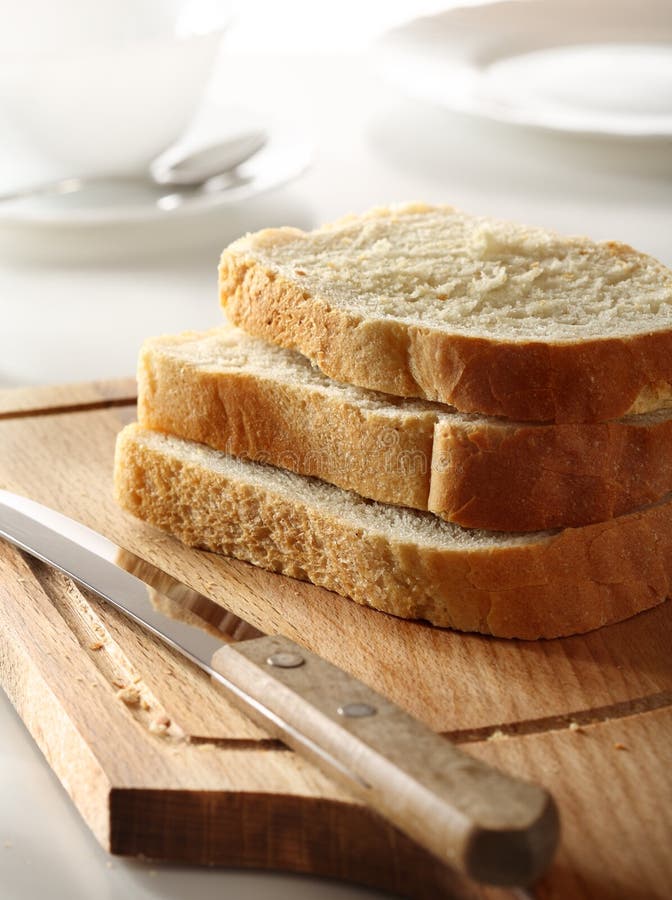Bread and knife stock image. Image of piece, light, plate 13189843