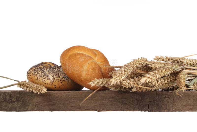 Bread loaf, buns and rolls in a studio setting against white background. Bread loaf, buns and rolls in a studio setting against white background