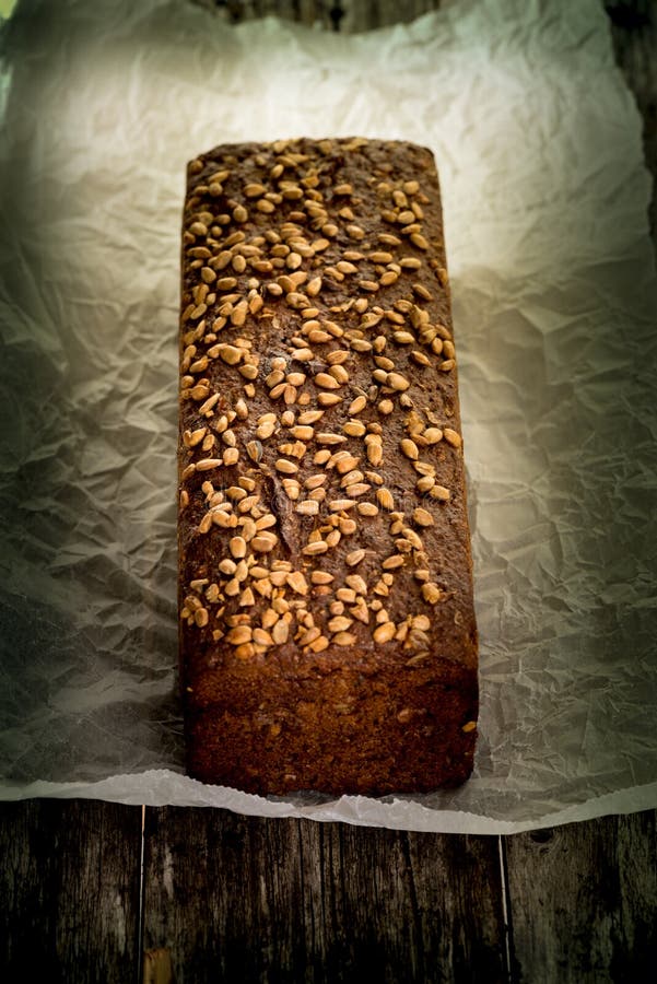 Bread loaf on paper stock image. Image of nutrition, crust - 65314161