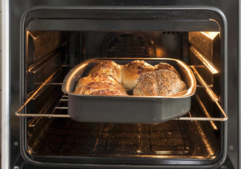 Freshly Baked Bread in Rustic Bakery with Traditional Oven Stock Image