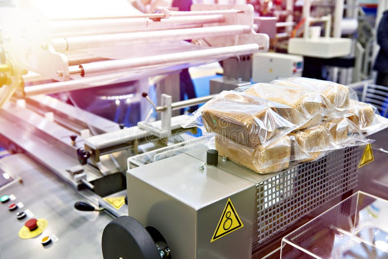 Bread packaging machine stock image. Image of package 139098411