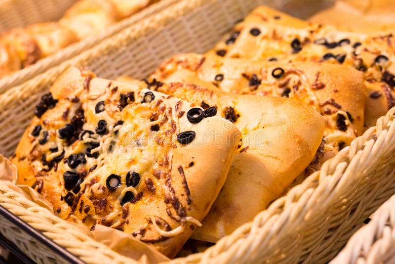 Bread Wheat Tortilla with Cheese and Black Olives on Bakery Counter