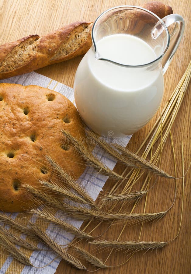 Bread, wheaten ears and a milk jug