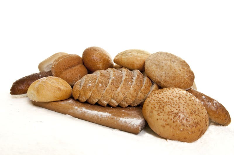 Bread on a wooden board sprinkled with flour