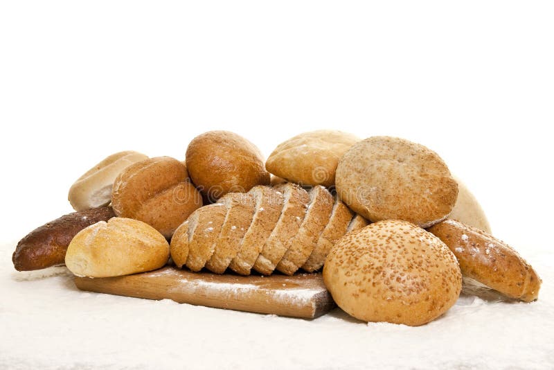 Bread on a wooden board sprinkled with flour