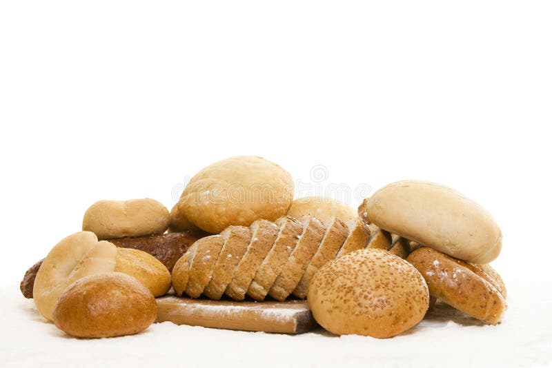 Bread on a wooden board sprinkled with flour