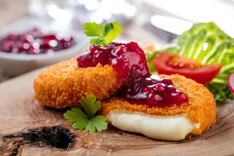 Breaded and Baked Camembert with Cranberry Sauce on Wooden Tabel ...
