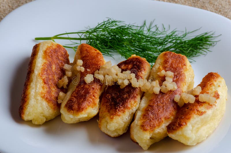 Breaded cheese and kefir sticks served in white plate. stock photo Breaded cheese and kefir sticks served in white plate. stock photo