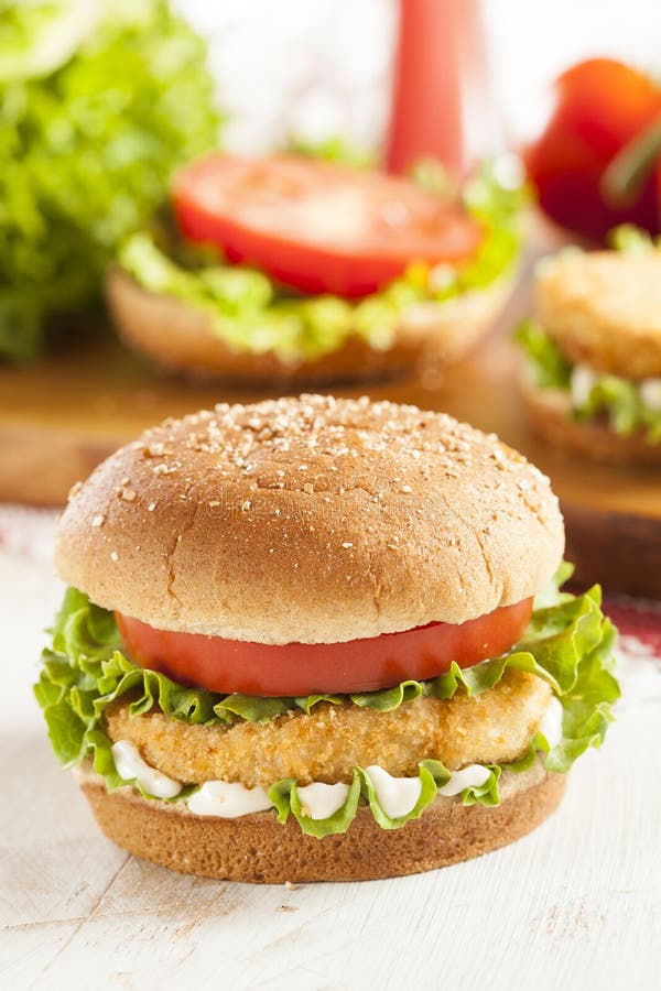 Breaded Chicken Patty Sandwich on a Bun Stock Photo - Image of leaf ...