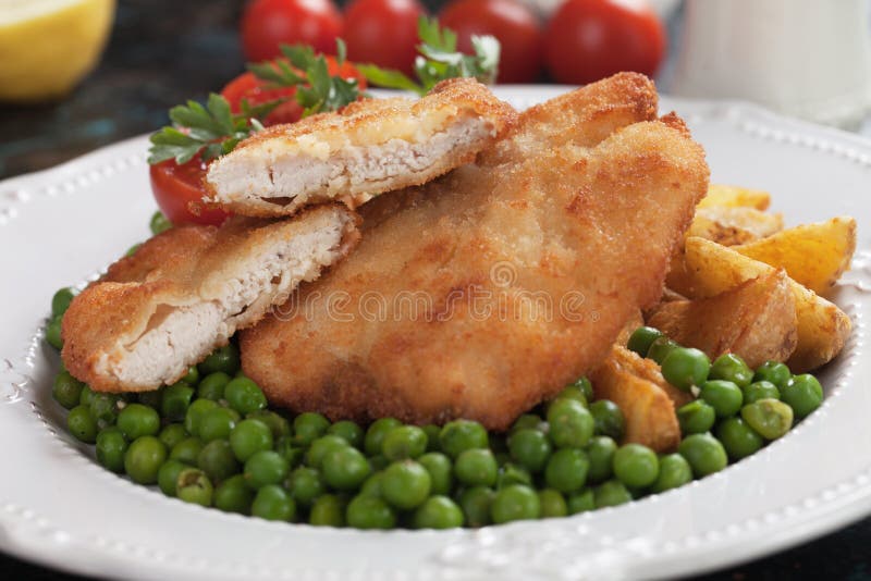 Breaded chicken steak stock image. Image of breaded 100989305