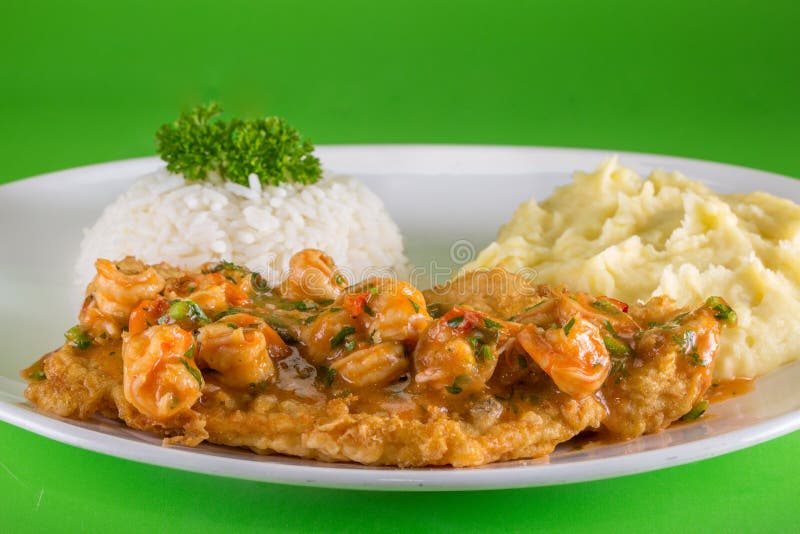 Breaded Fish Dish with Shrimp Sauce, White Rice and Mashed Potatoes on