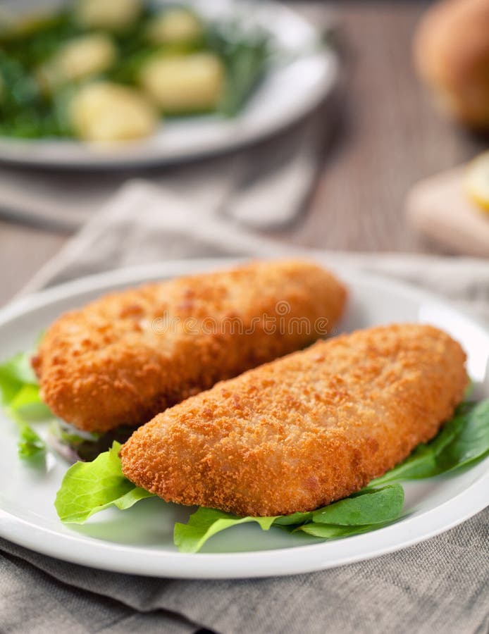 Breaded Fish Fillet With Salad. High quality photo. stock photography